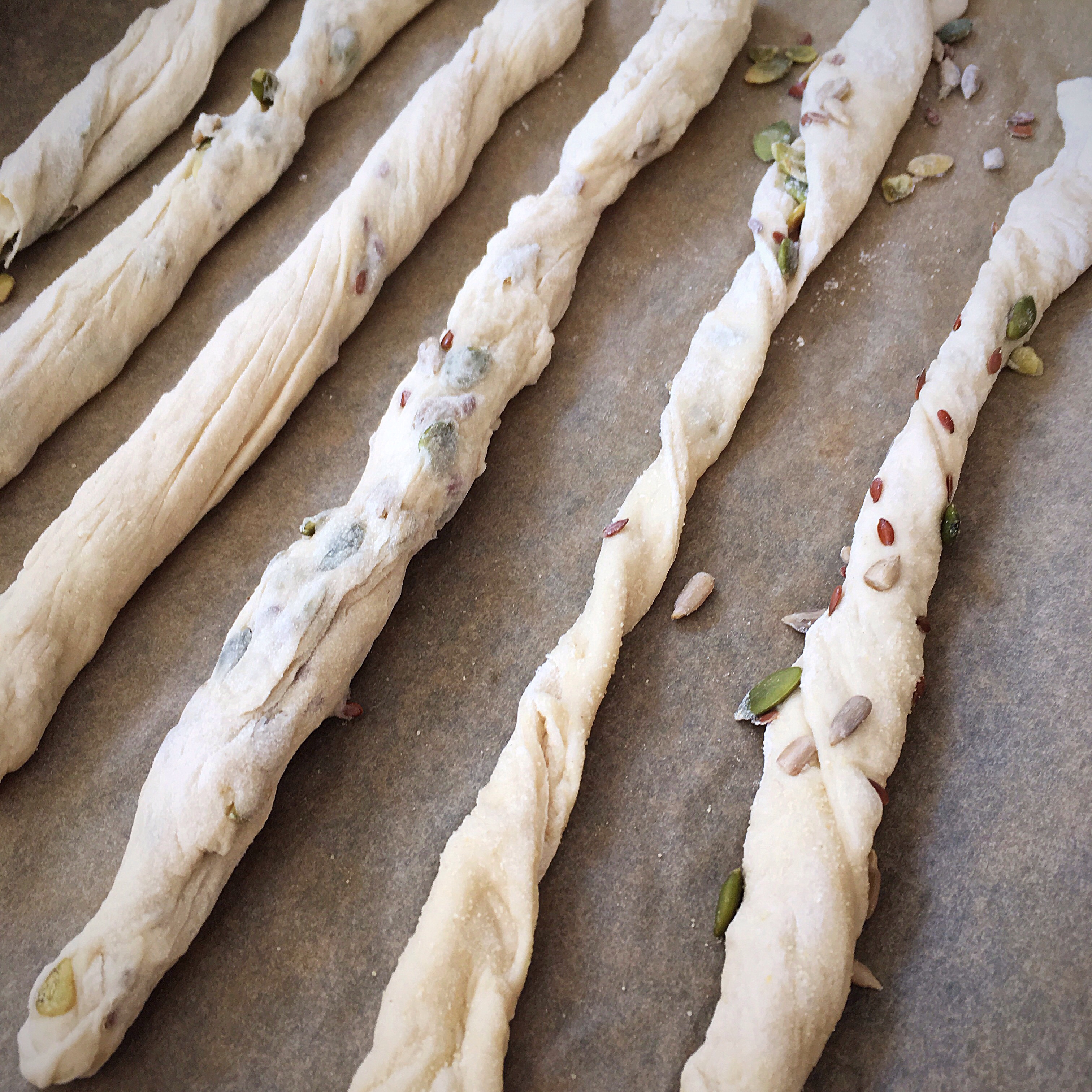 A close up of some bread sticks on the table