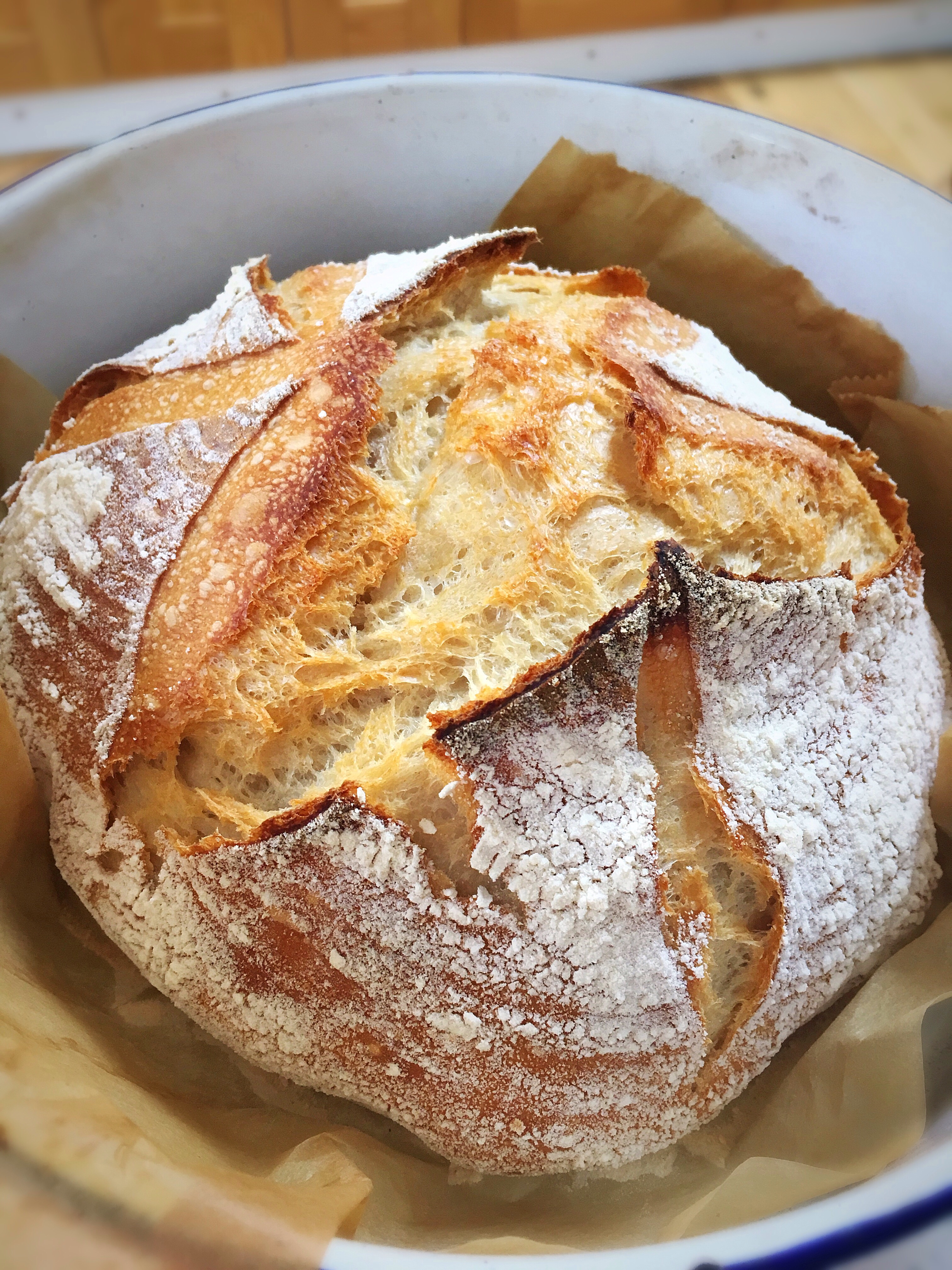 A loaf of bread with some cheese on top.