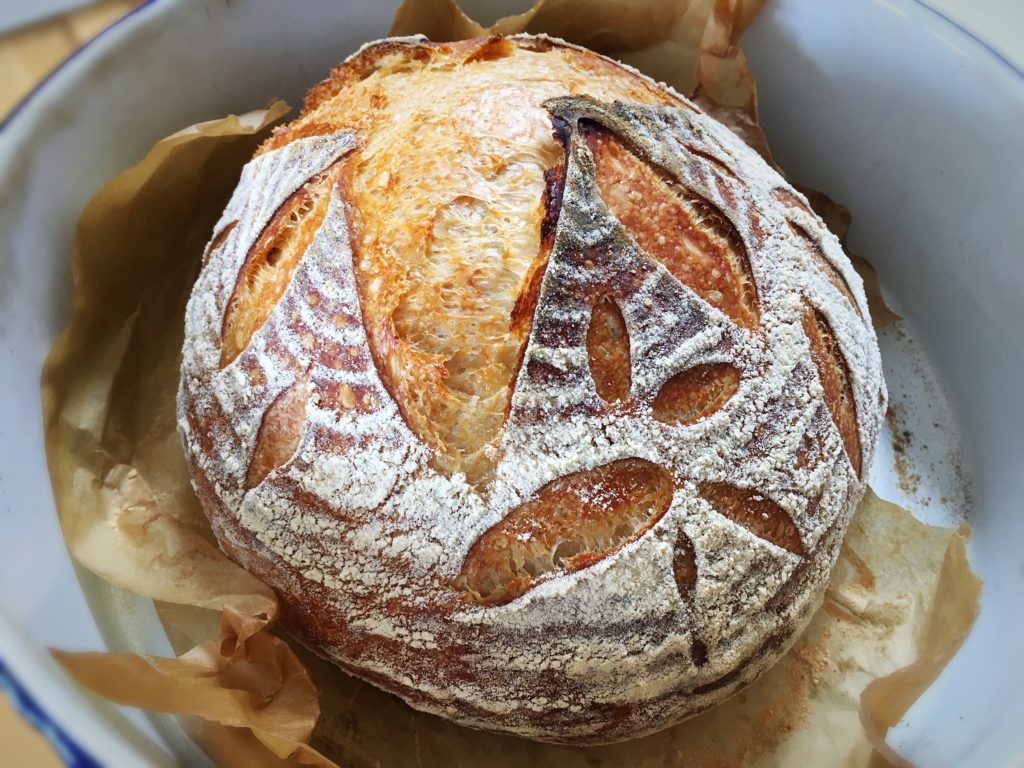 A loaf of bread with many different designs on it.