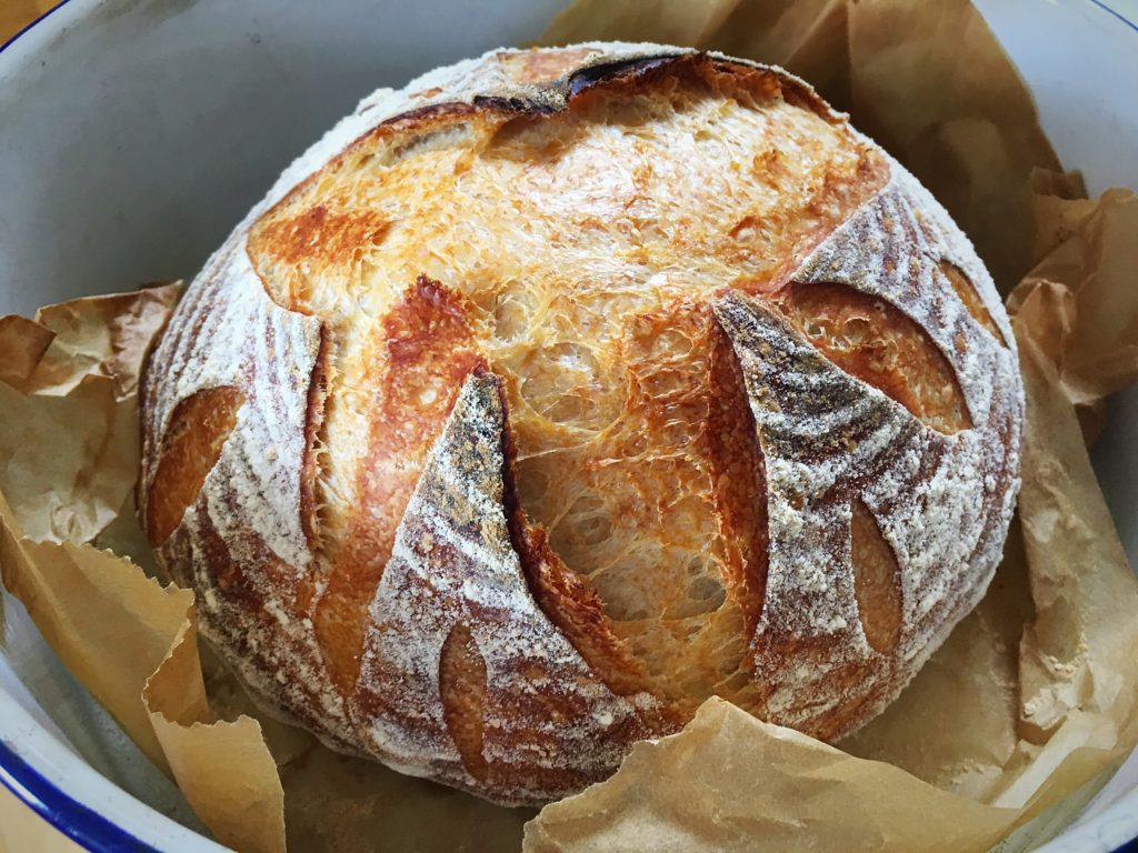 A loaf of bread is sitting in the basket.