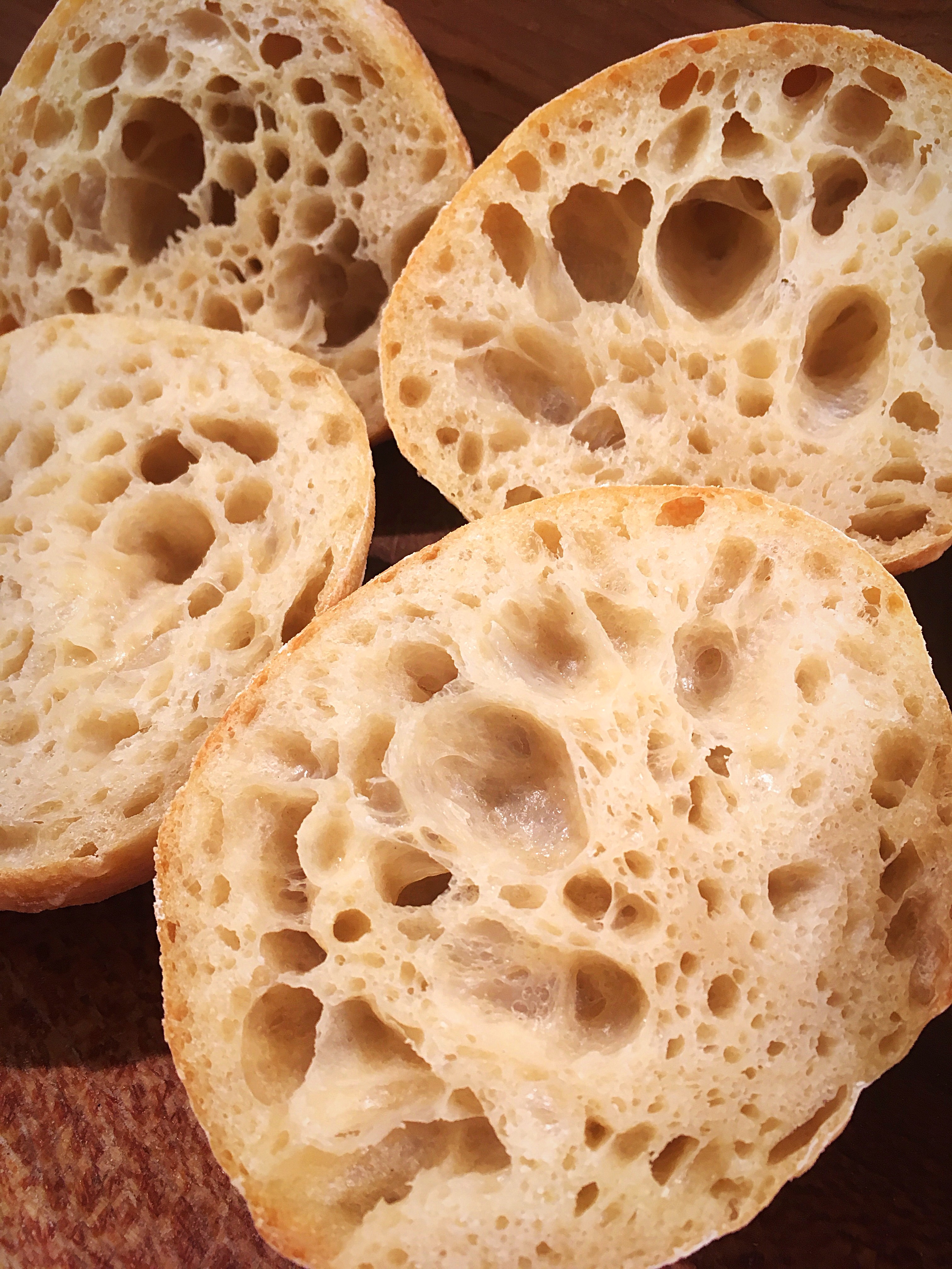 A close up of some bread with holes in them