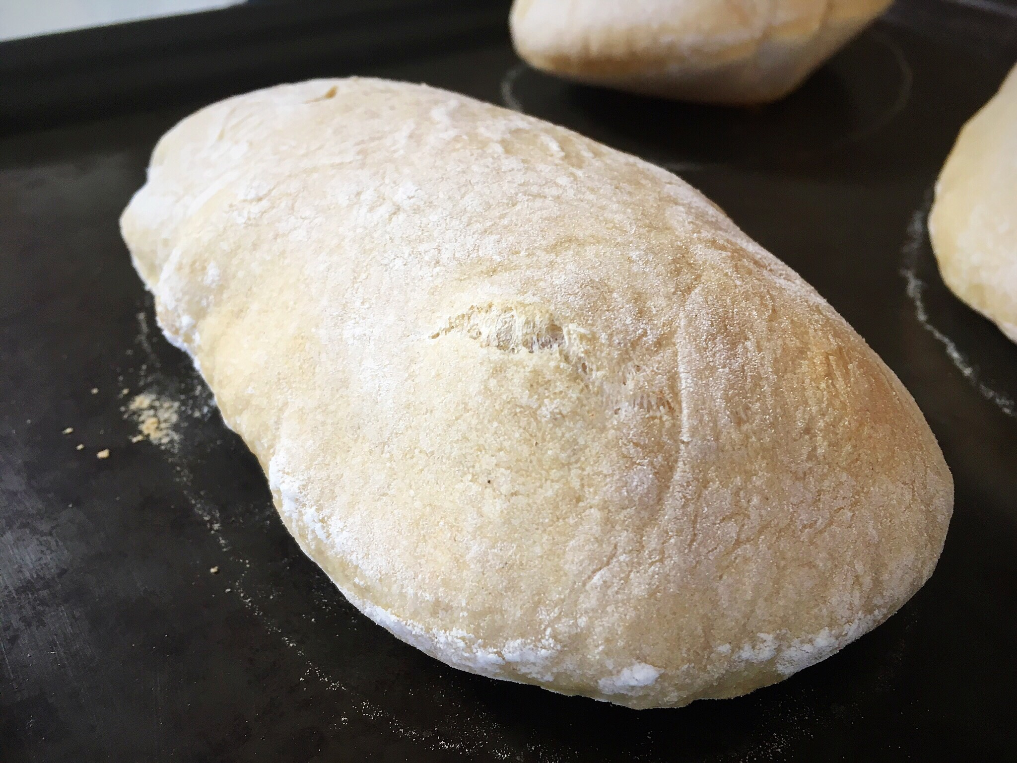 A loaf of bread is sitting on the counter.