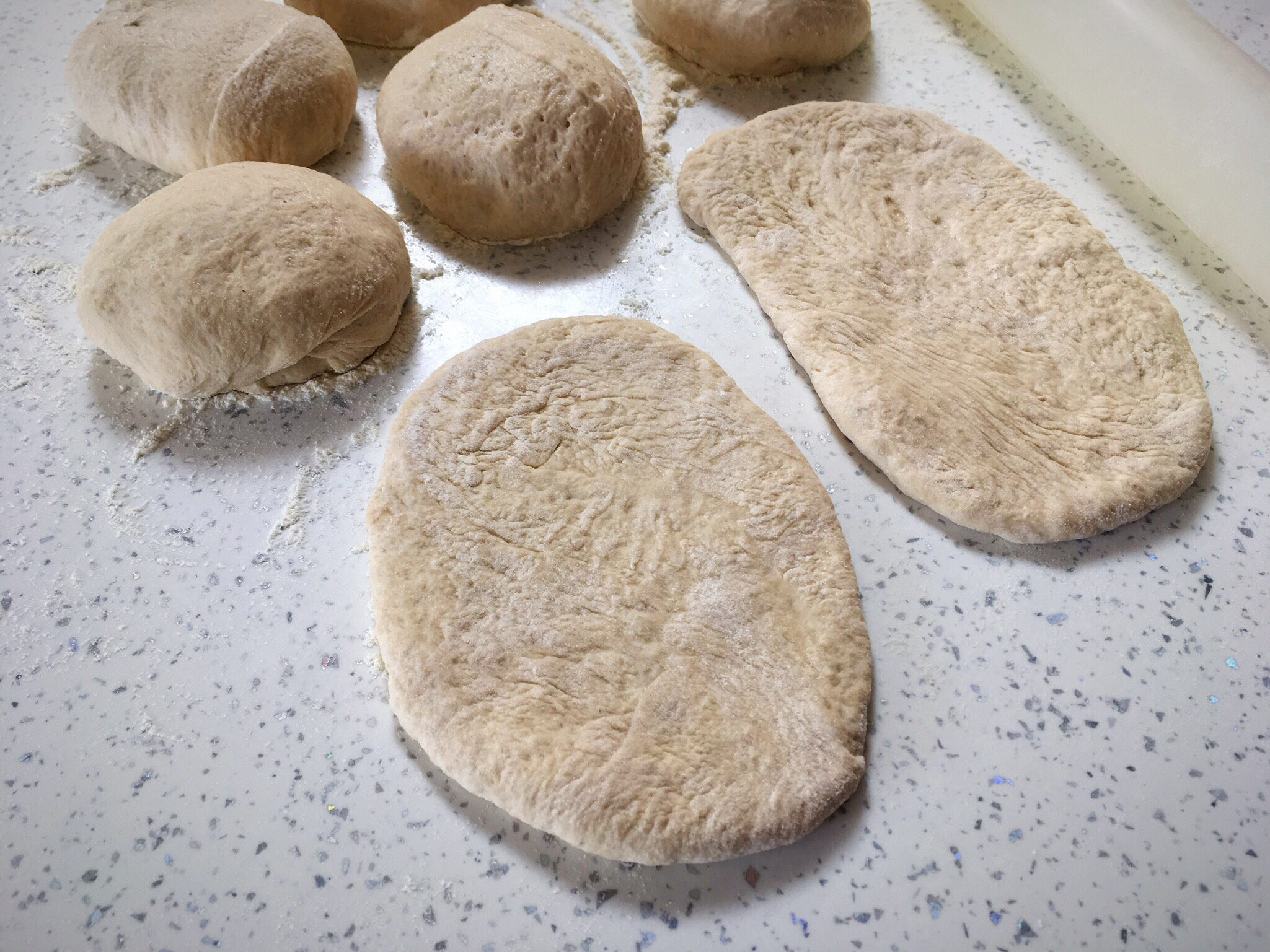 A close up of some bread dough on the counter