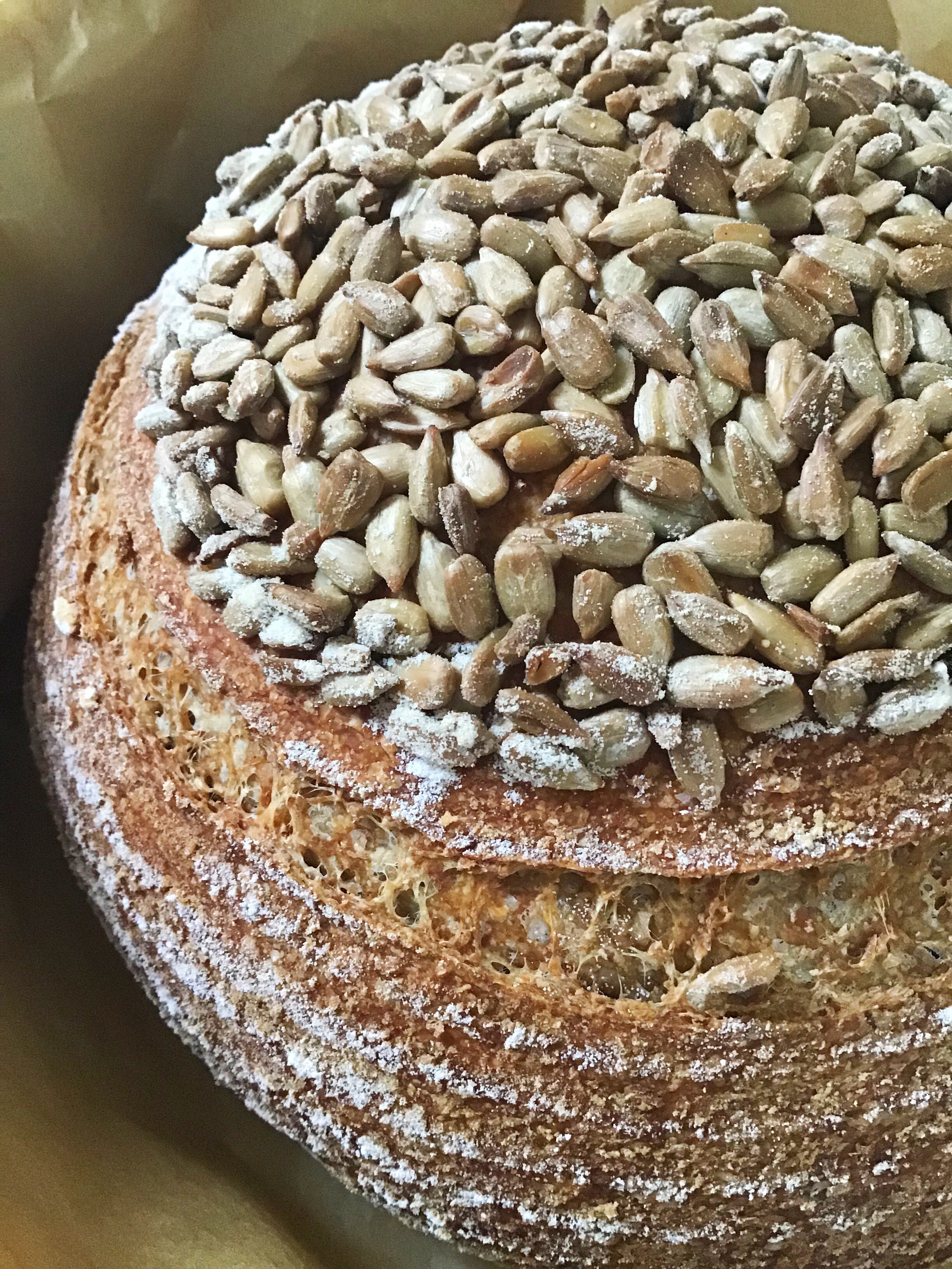 A close up of some bread with nuts on top