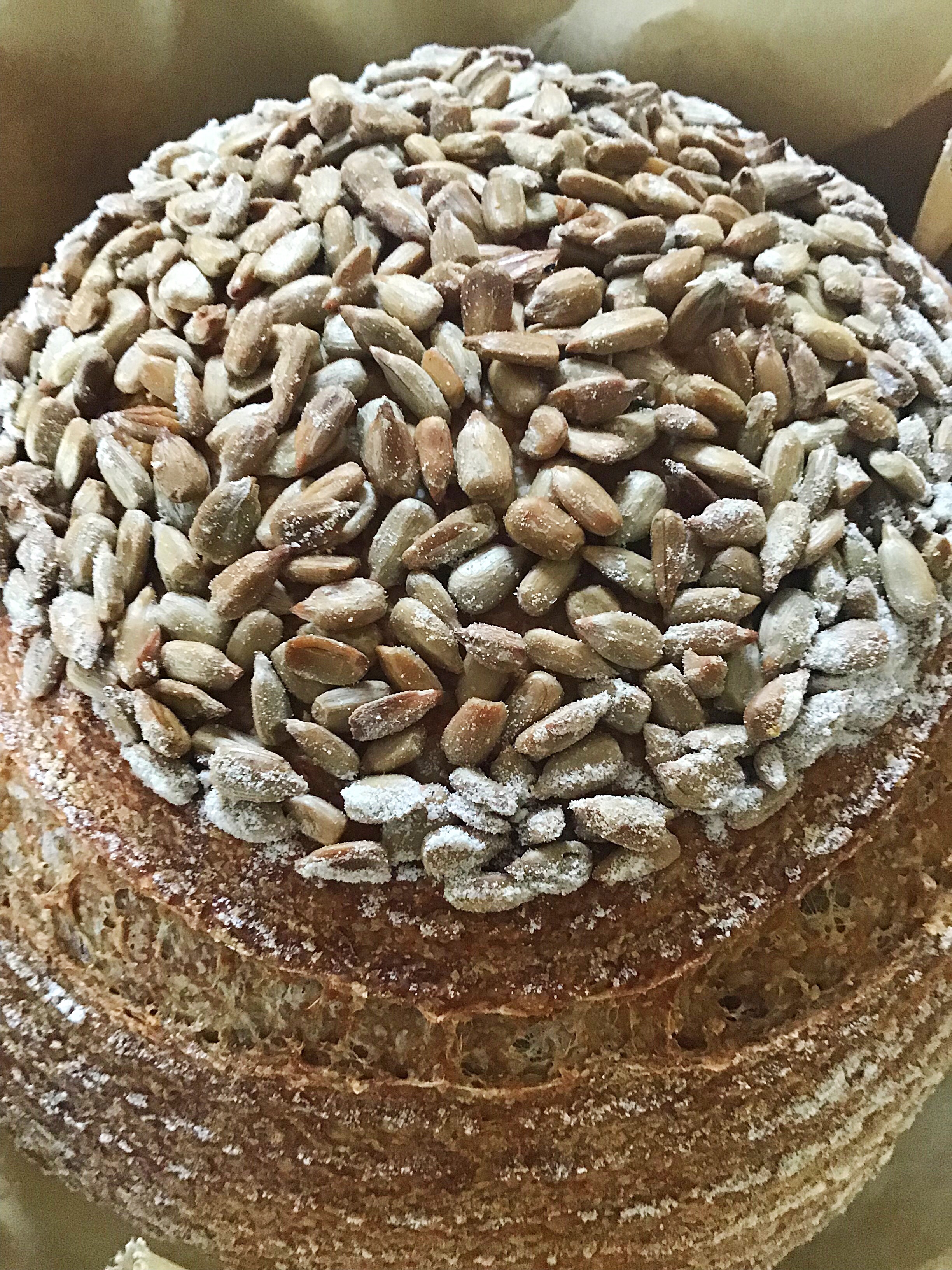 A cake with nuts on top of it.