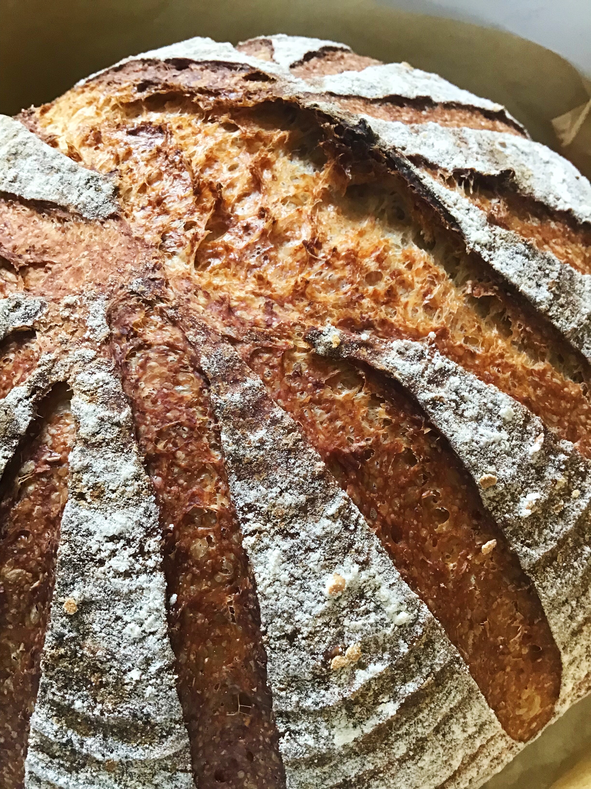 A loaf of bread with silver leaf on it.