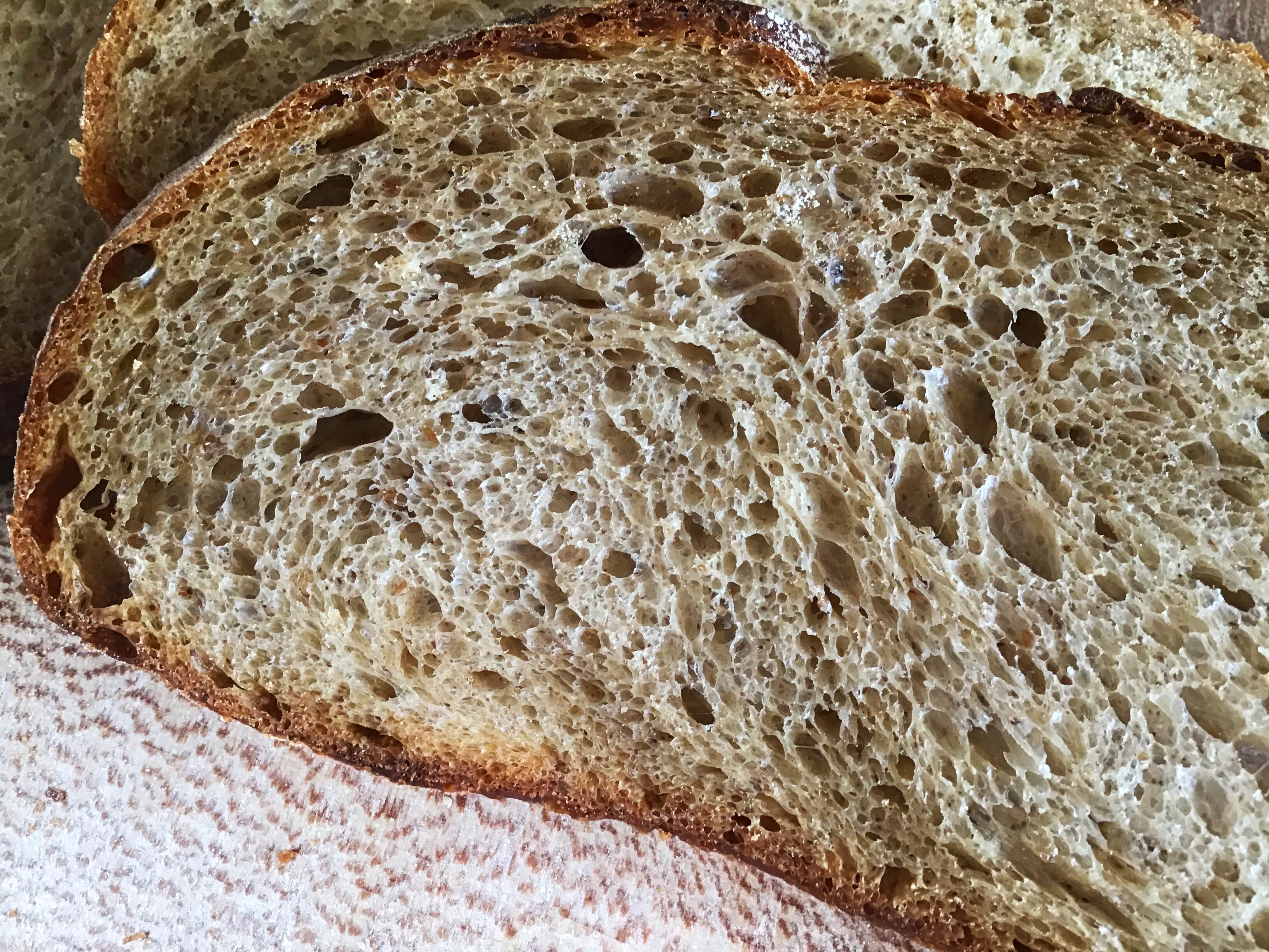 A piece of bread with many holes in it.