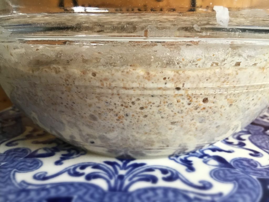 A bowl of food on top of a blue and white table.