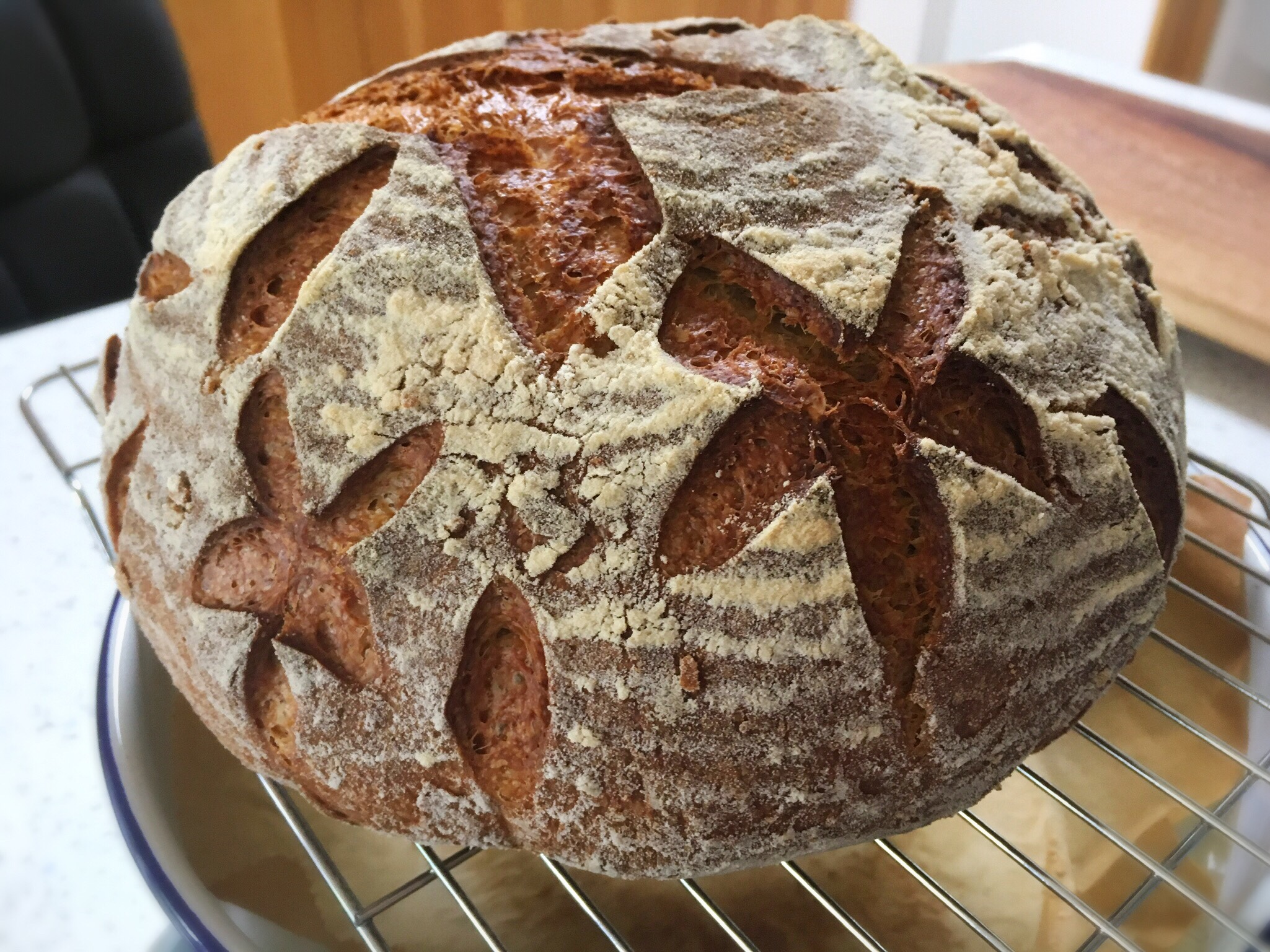 A loaf of bread with a cross cut out on it.