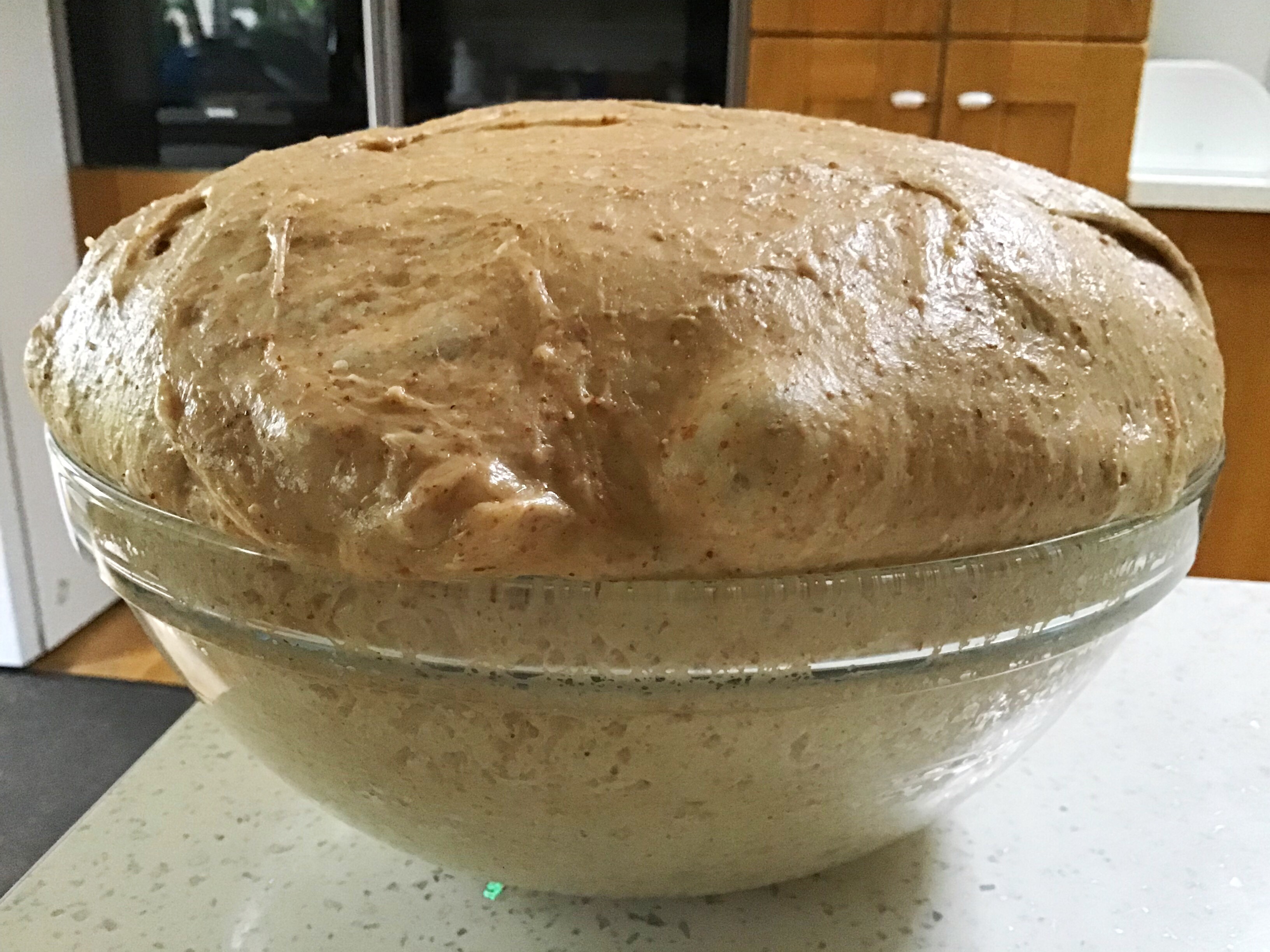 A bowl of bread sitting on top of a table.