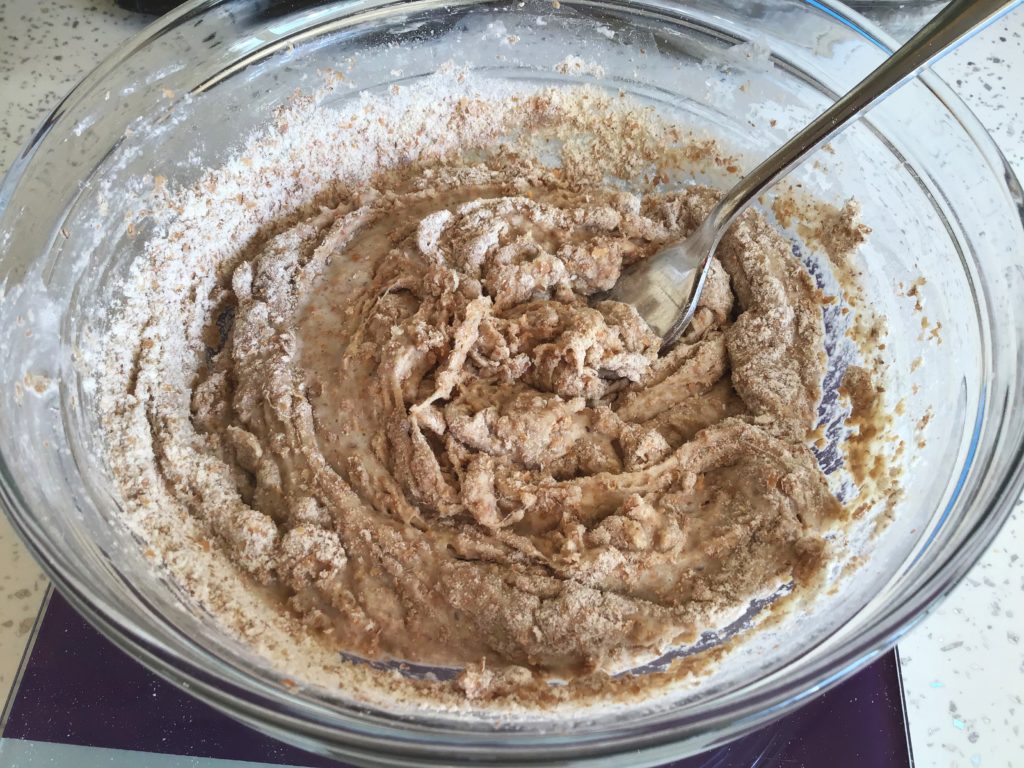 A bowl of food with some kind of brown substance