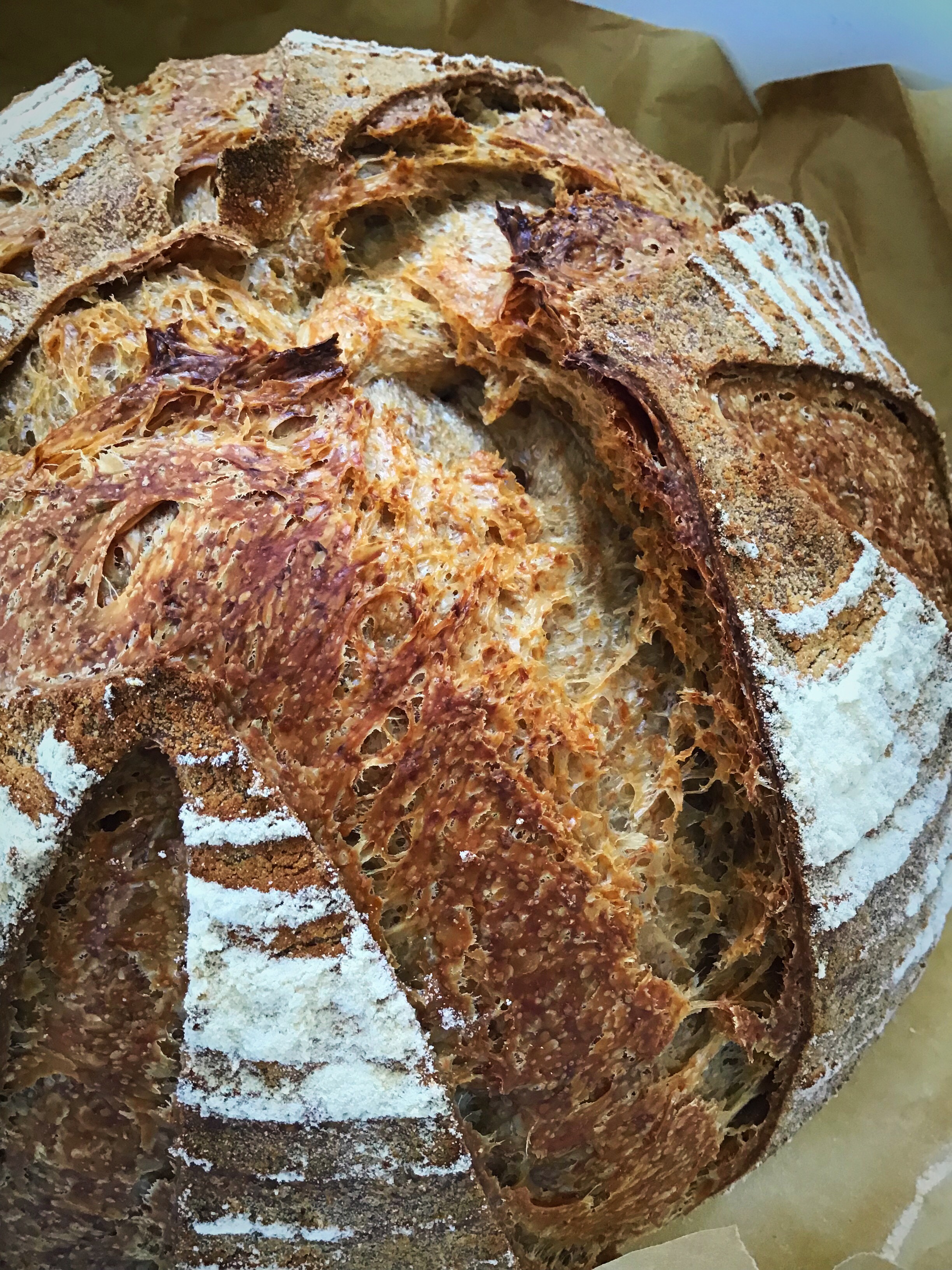 A loaf of bread with many different types of food.