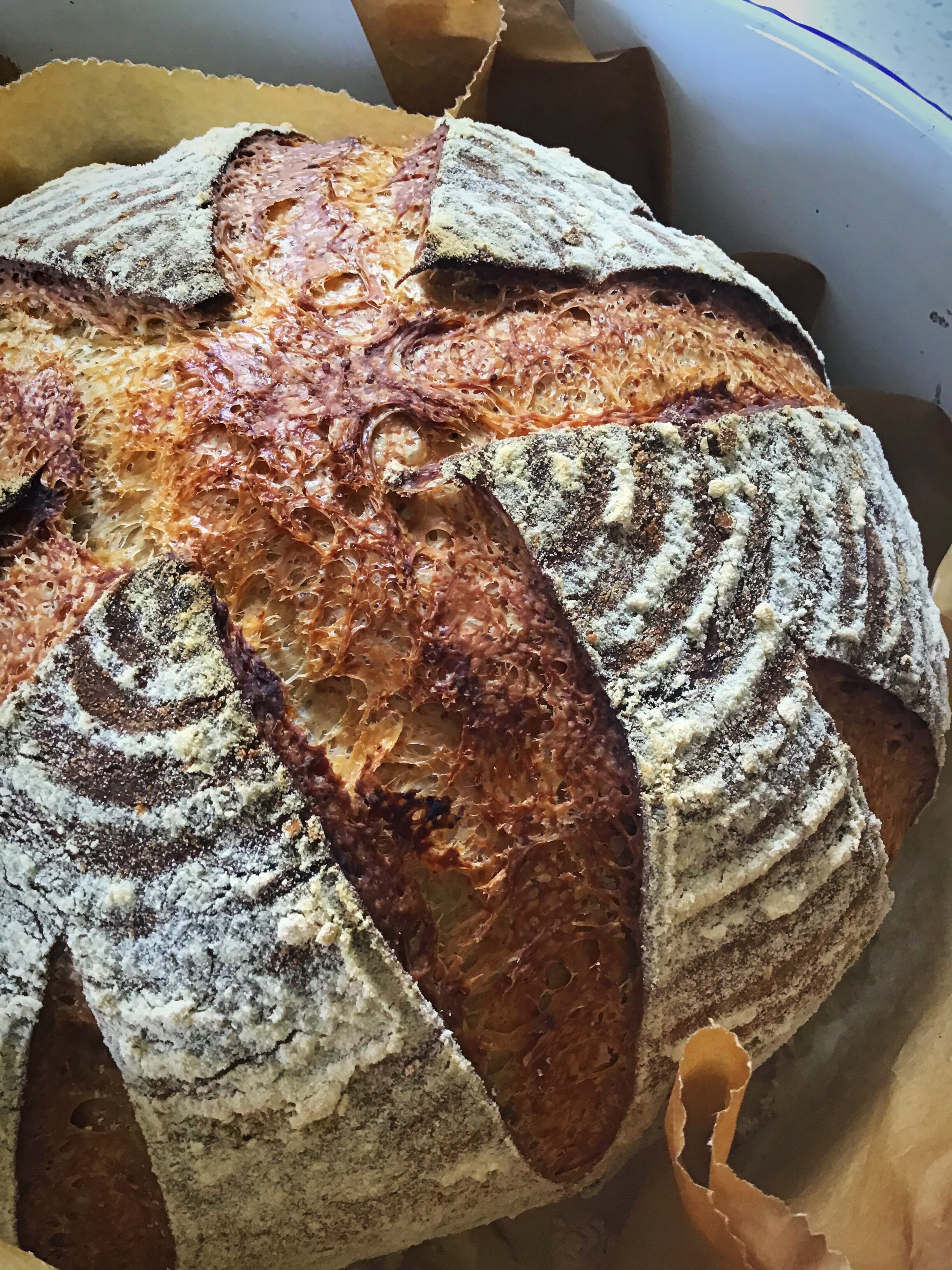 A loaf of bread with different colored and patterned breads.