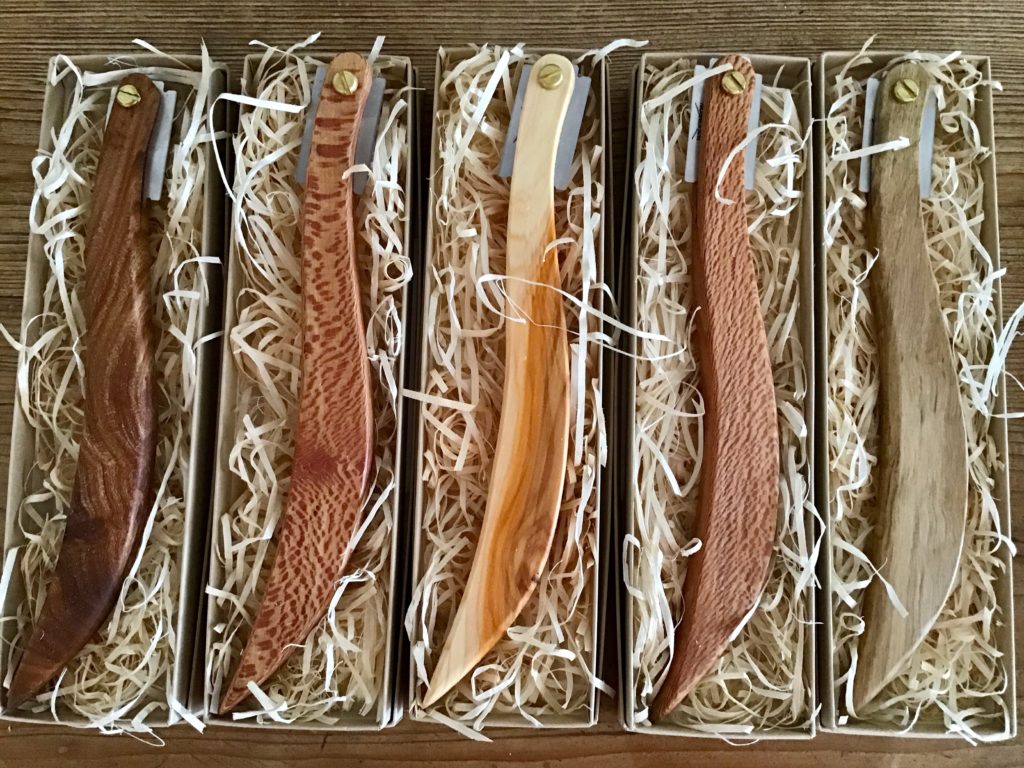 A box of wooden pens and pencils