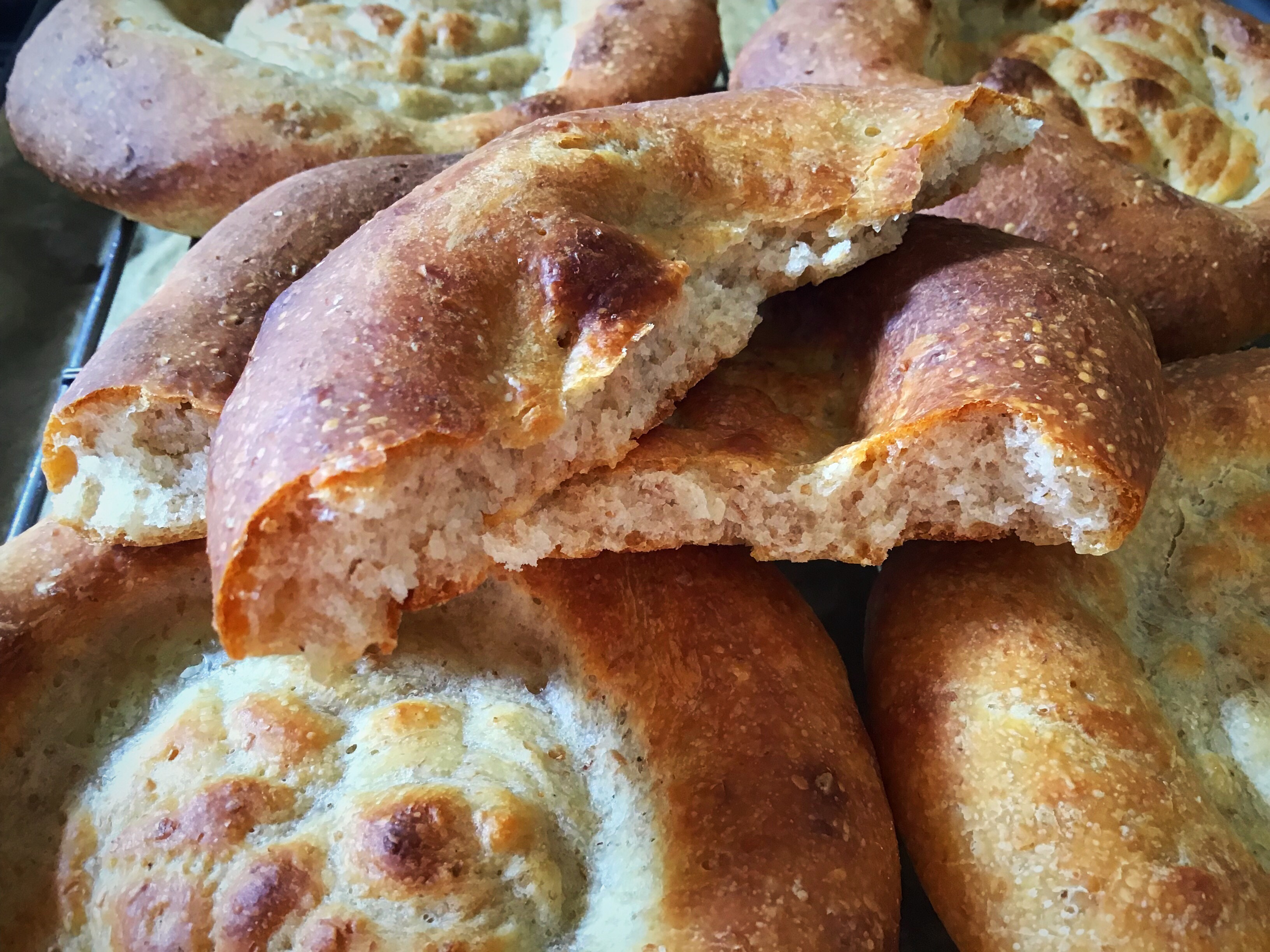 A close up of some bread rolls on the table