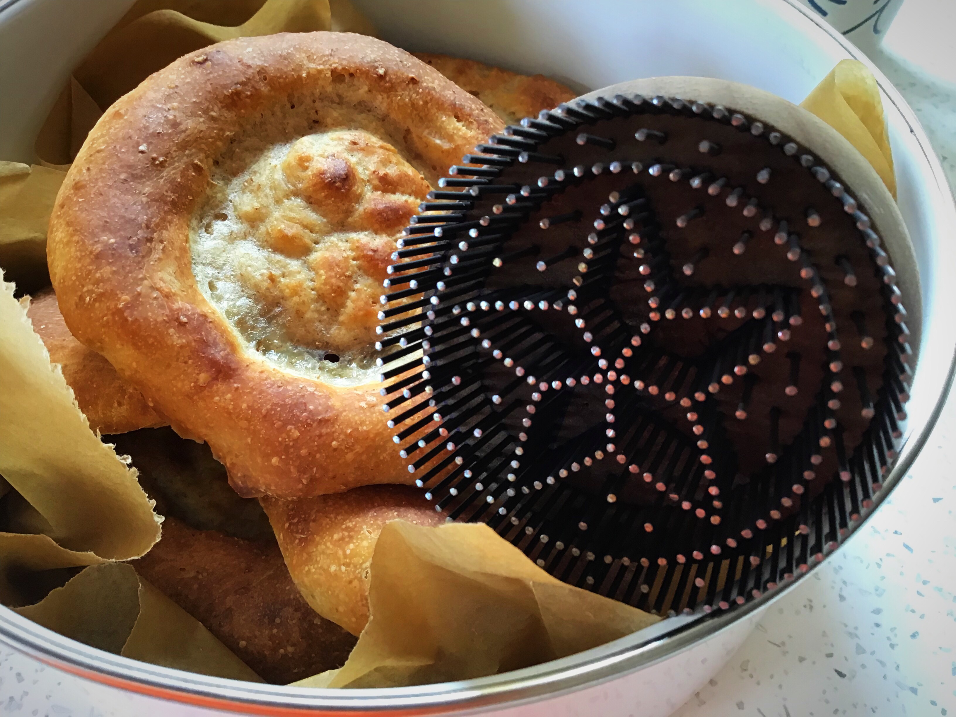 A bowl of food with some kind of hair brush