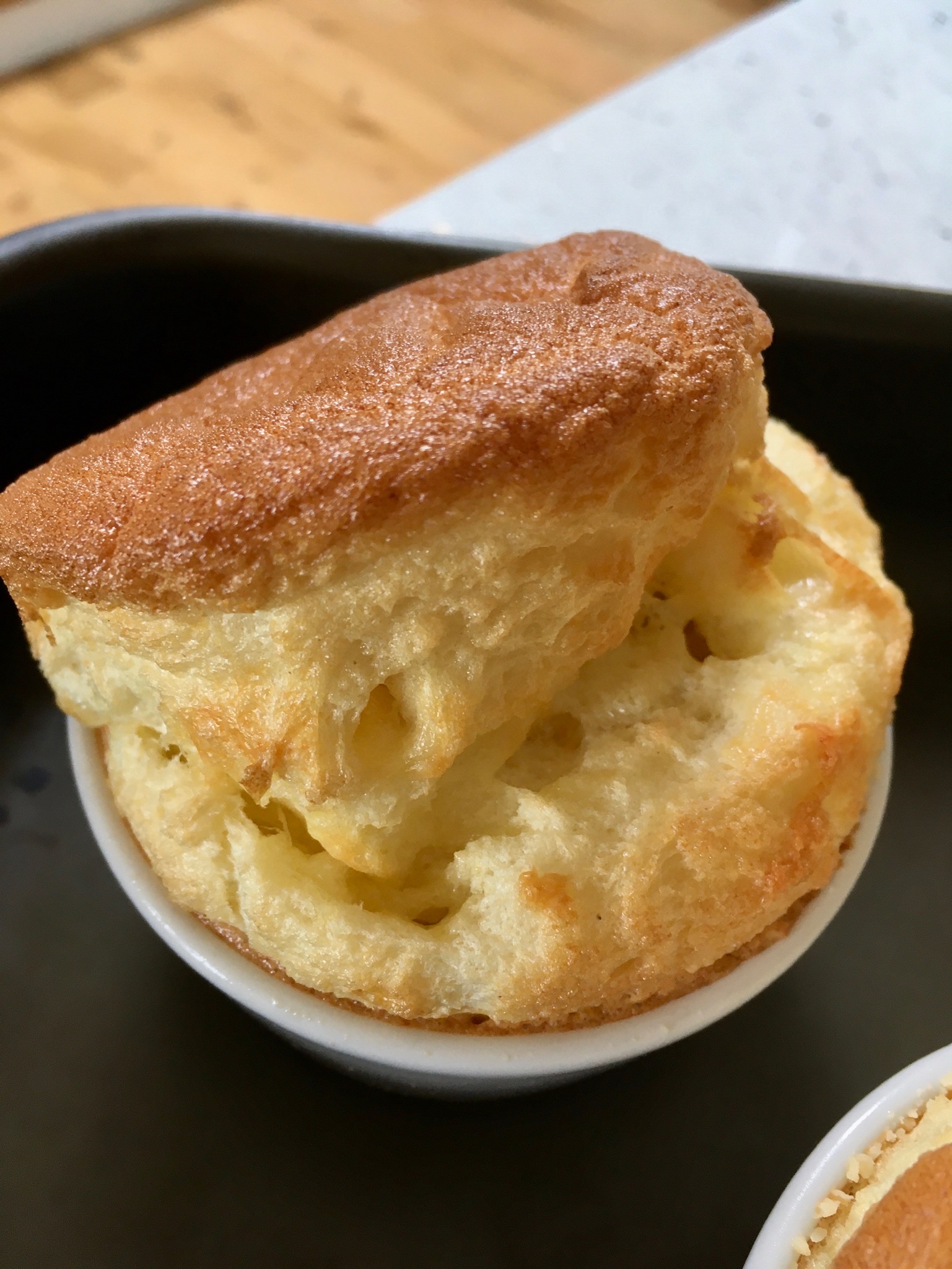 A small bowl of food on top of a table.