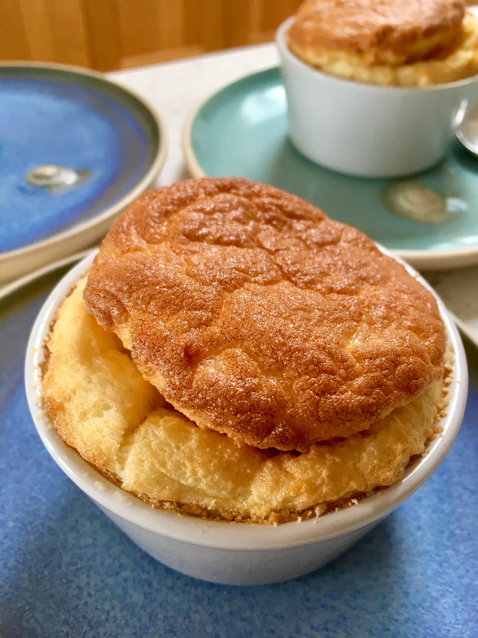 A bowl of food with two pieces of bread on top.