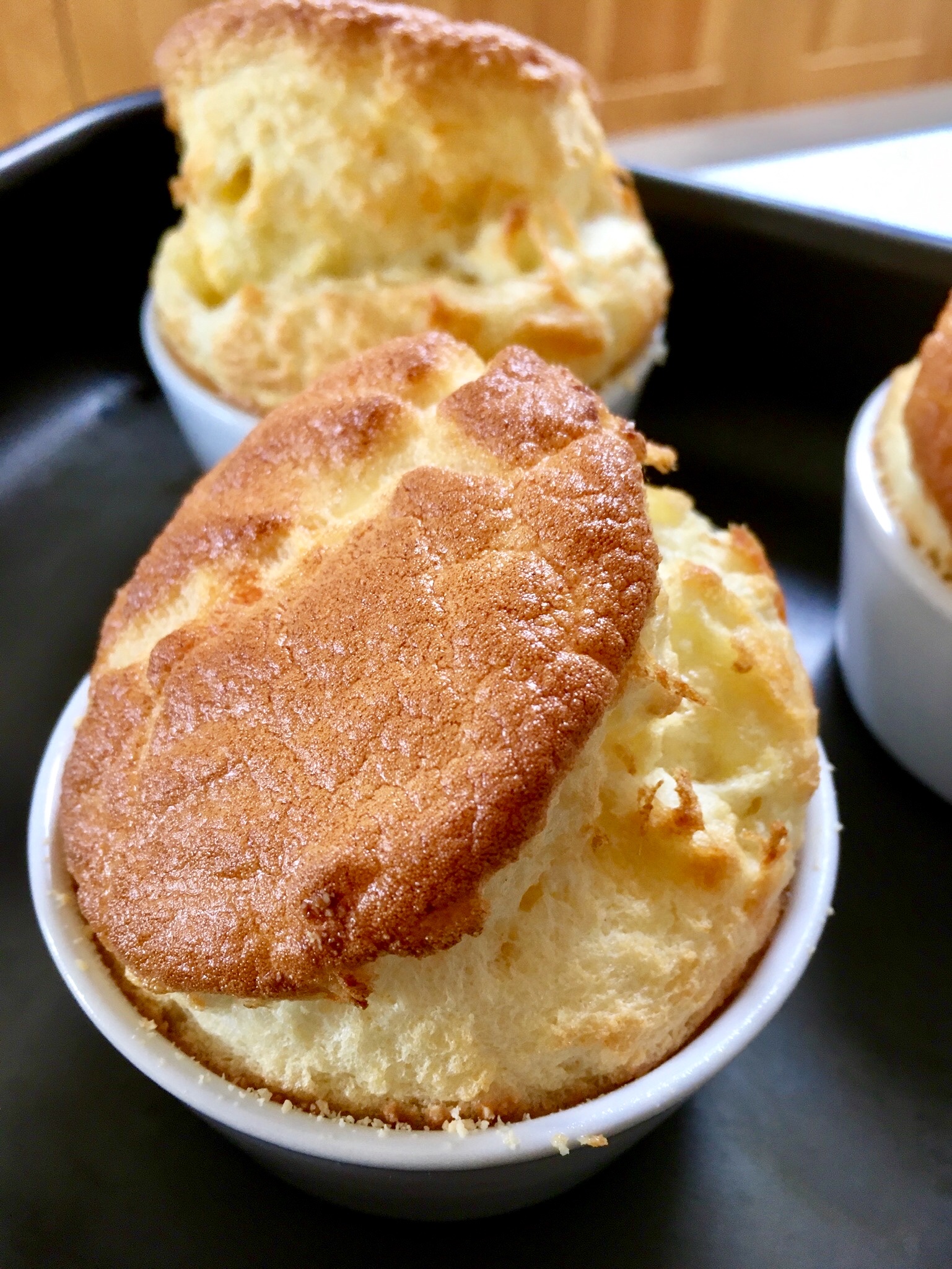 A close up of some baked dessert in white dishes