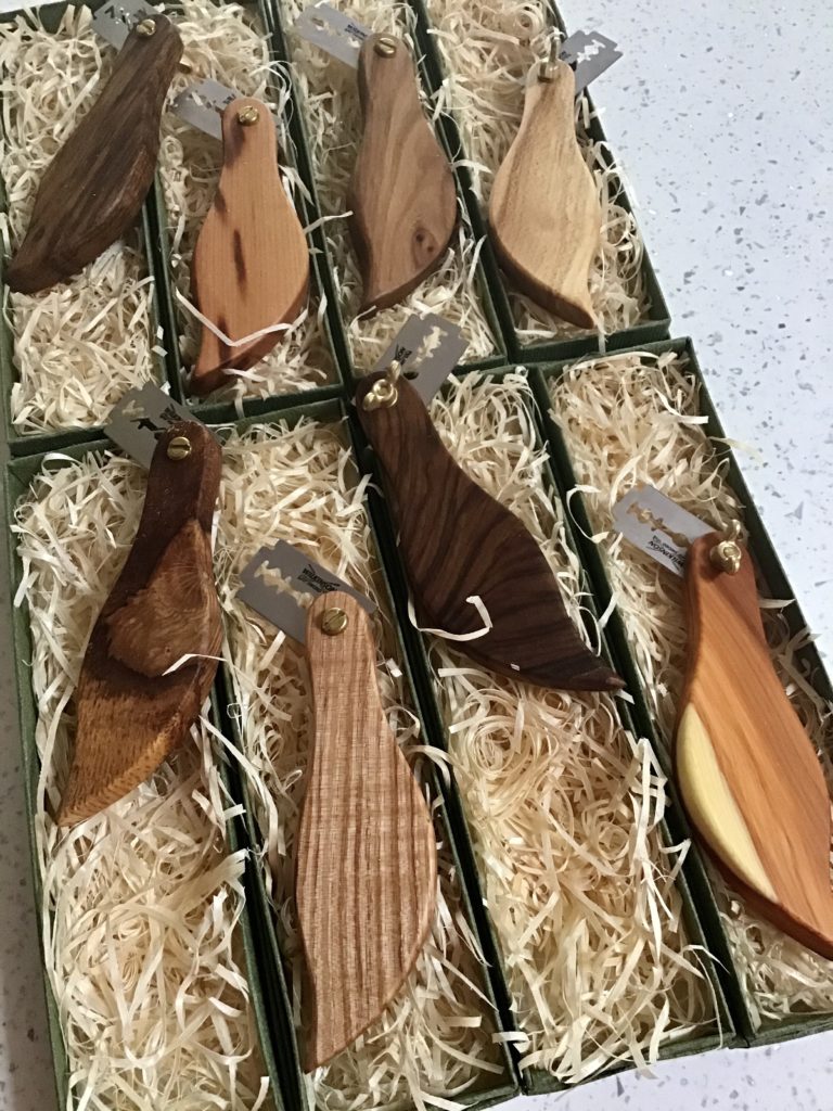 A wooden box with many different wood items in it