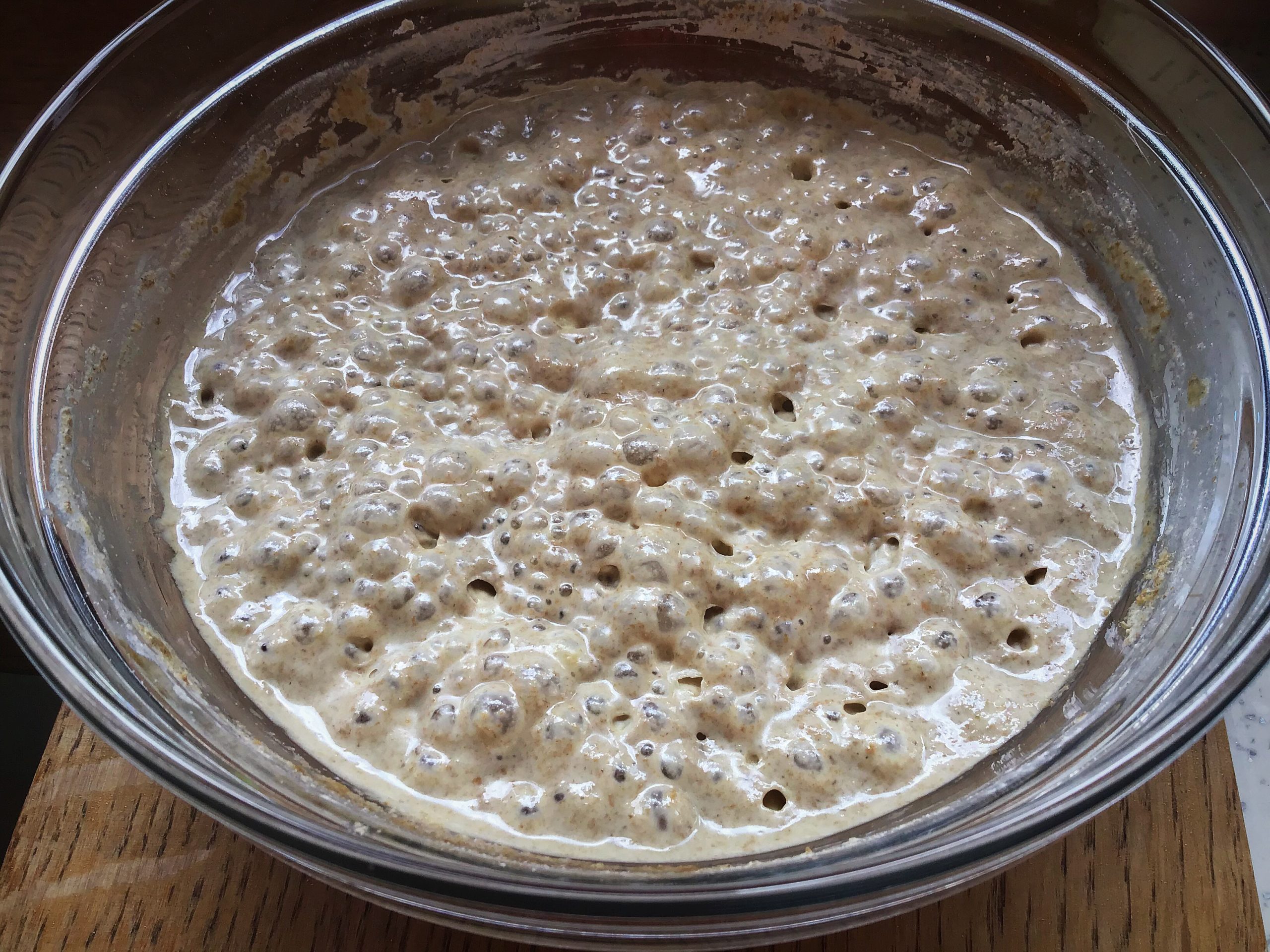 A bowl of rice and water on the table.