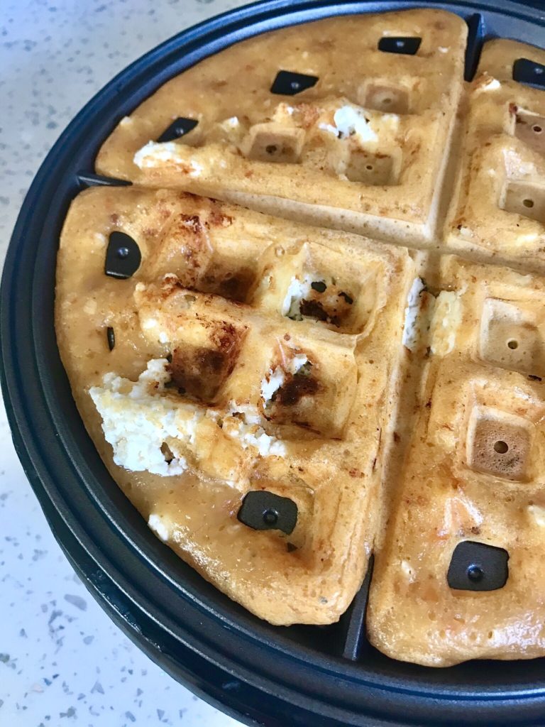 A close up of a waffle in the middle of it