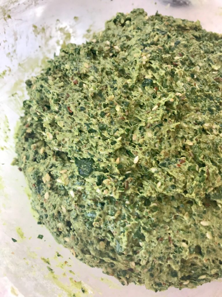 A bowl of green stuff is shown.