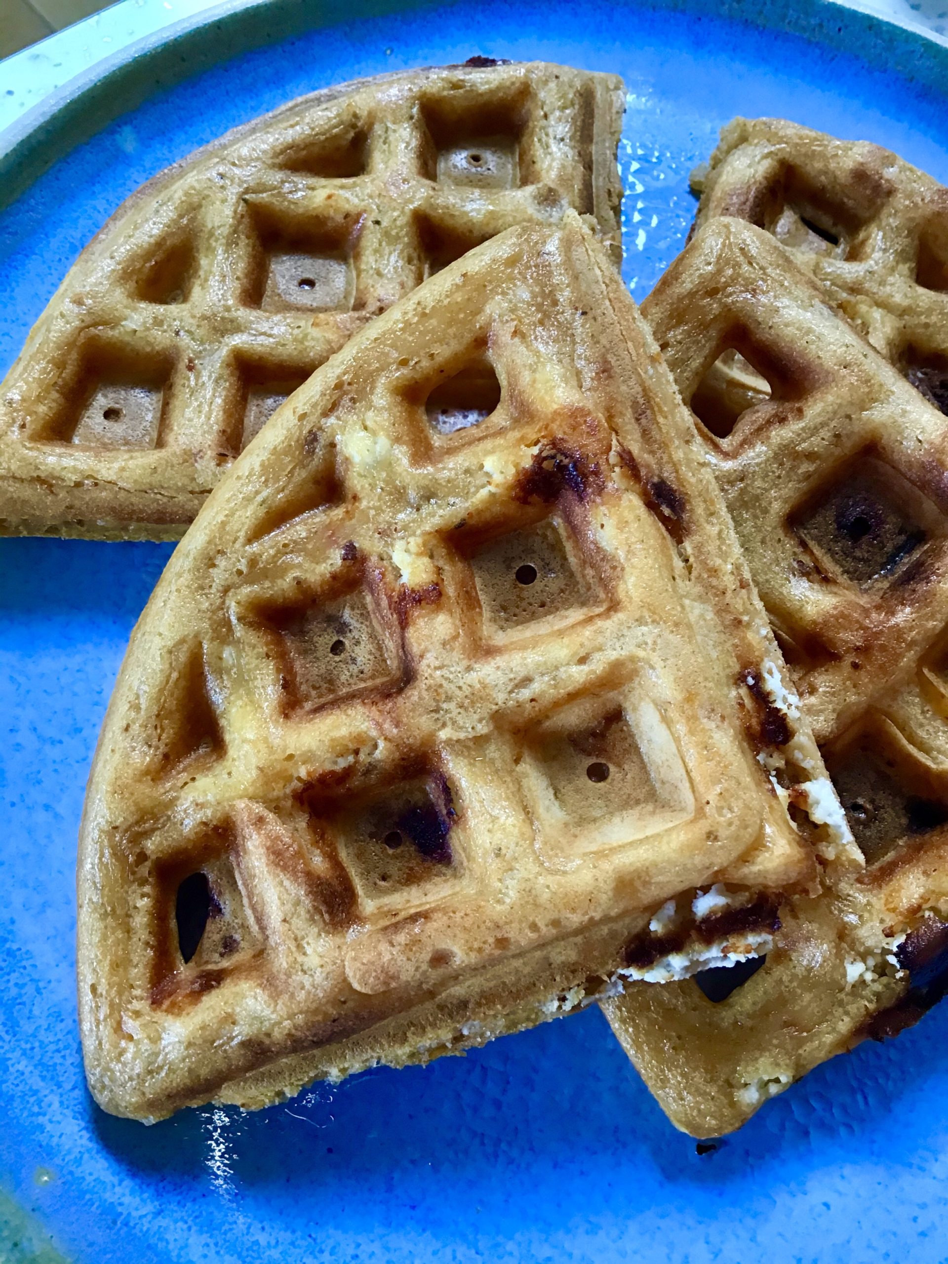 A close up of some waffles on a plate