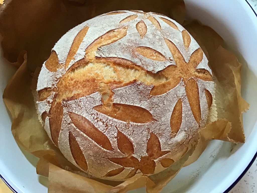 A loaf of bread with leaves drawn on it.