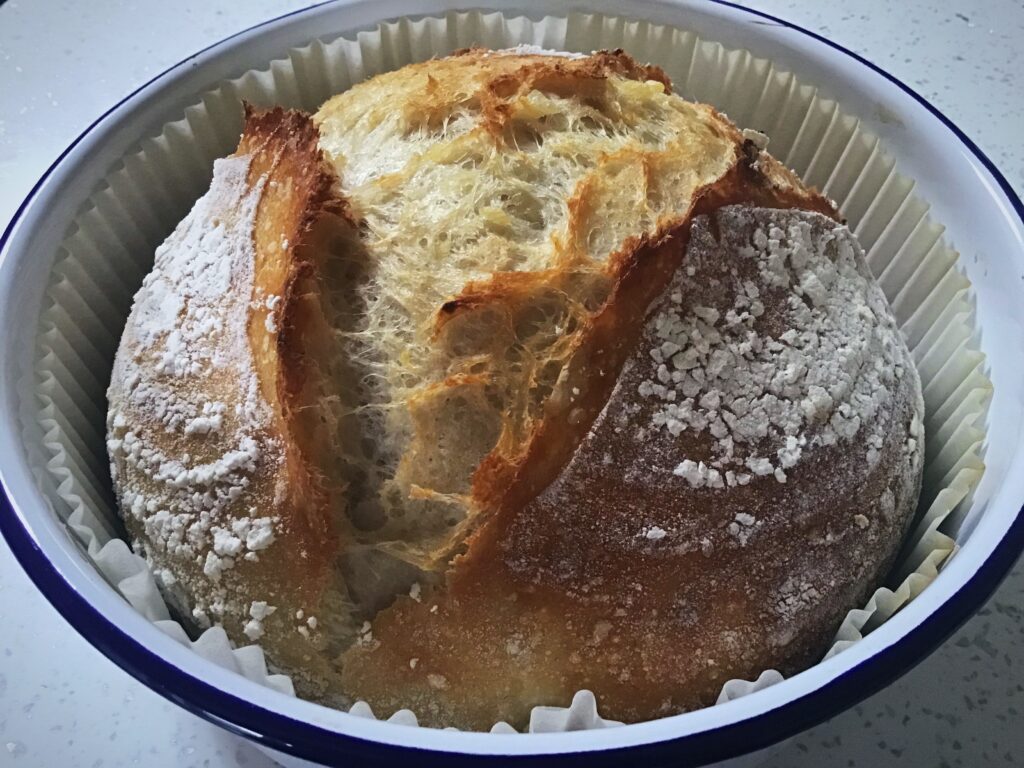 A cake in a pan with some frosting on top